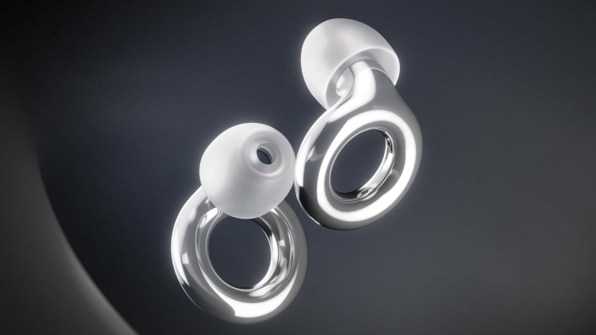 a pair of metallic Loop ear plugs with a dark background