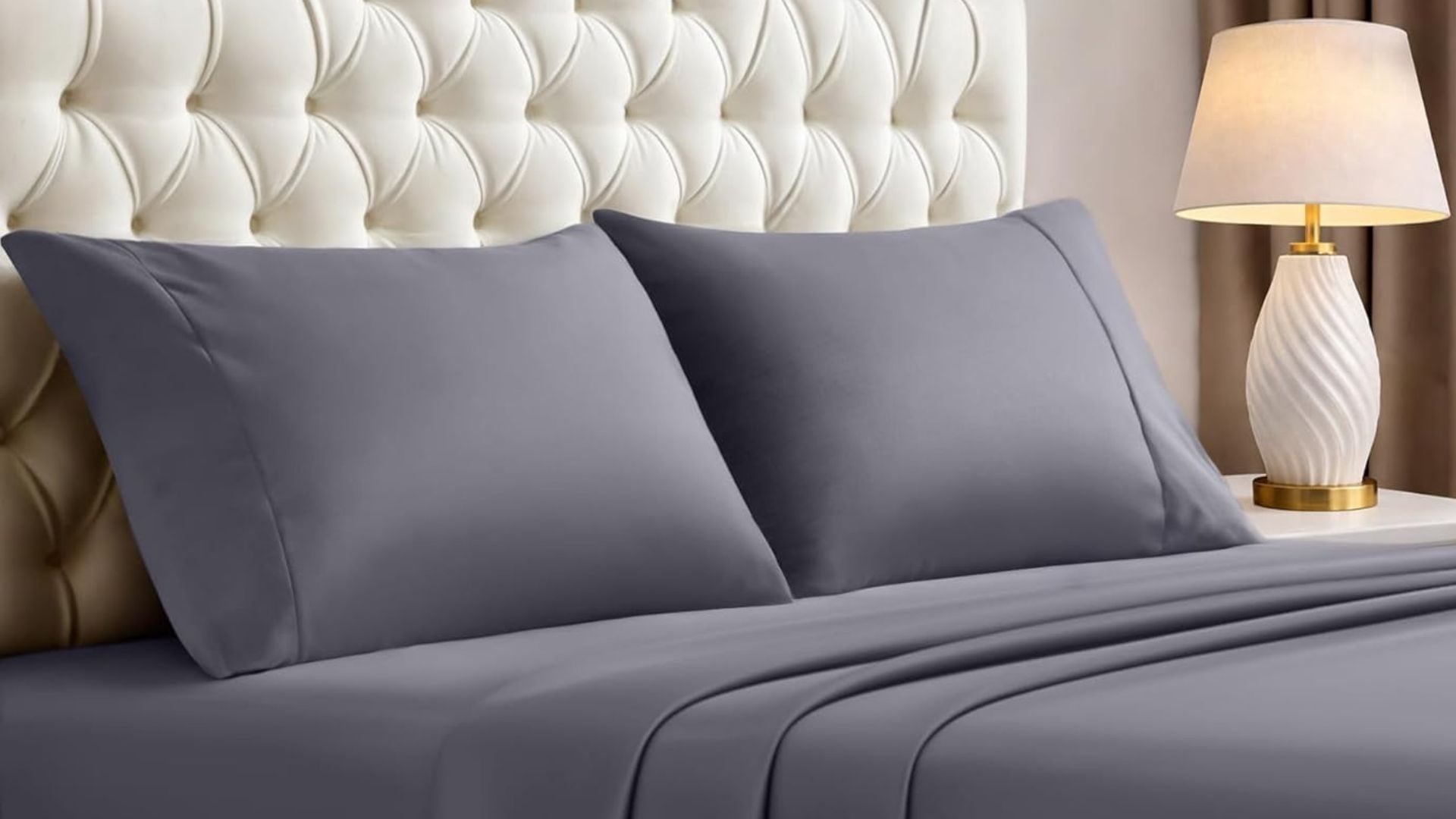 A grey Utopia Bedding Sheet Set on a bed.