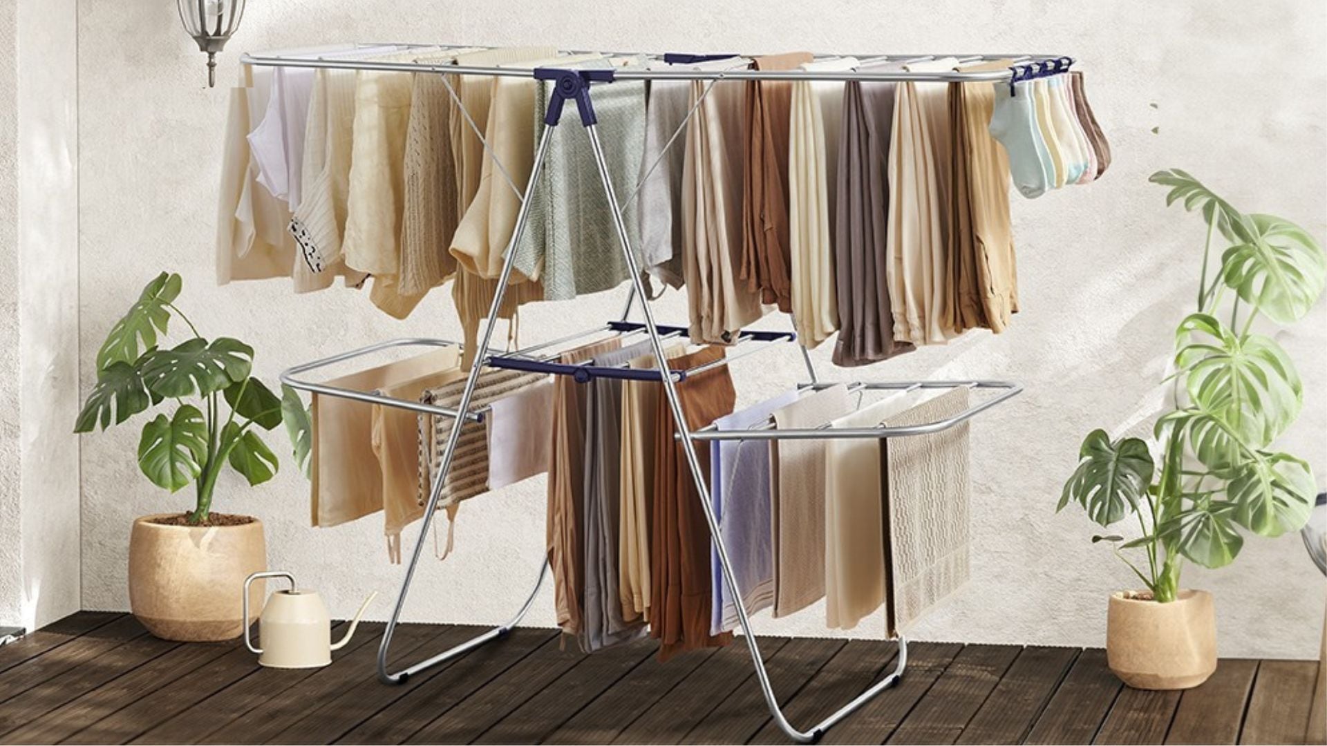 A load of laundry hanging from the drying rack.