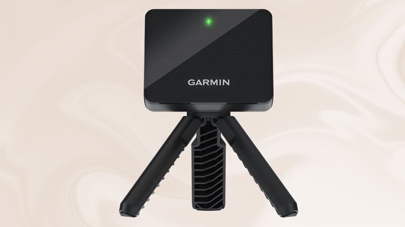 The Garmin Approach R10, Portable Golf Launch Monitor, on a swirly background.