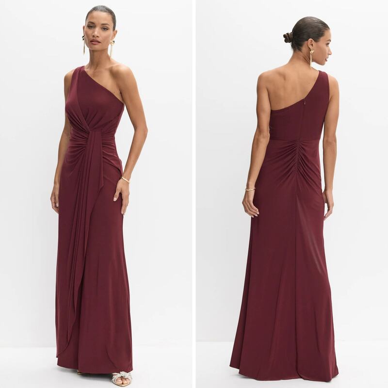 A person wearing a maroon Melanie Lyne dress.