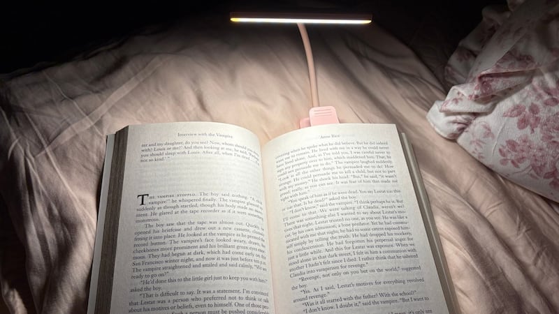 The wide book lamp illuminating both pages of an open book
