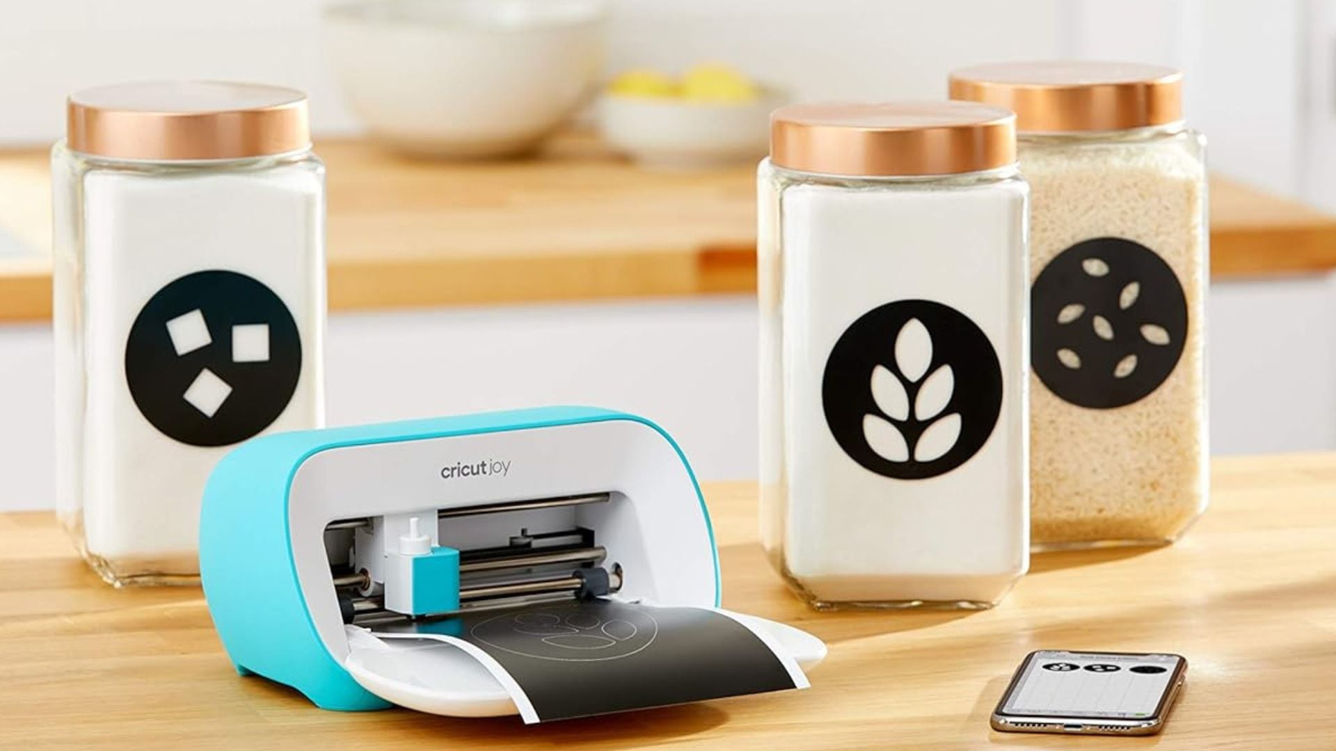 A Cricut Joy on a wooden countertop.