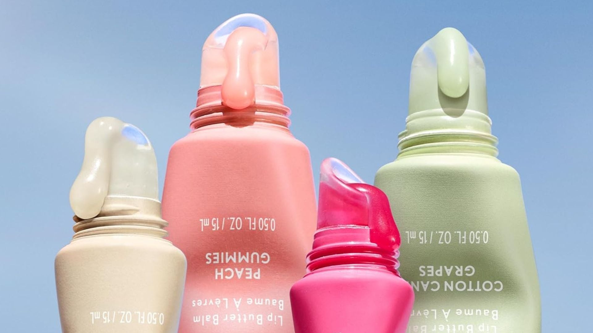 Four CoverGirl Lip Butter Balms.